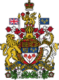 A shield of four rectangles over a triangle. The first rectangle contains three lions passant guardant in gold on red; the second, a red lion rampant on gold; the third, a gold harp on blue; the fourth, three gold fleurs-de-lis on blue. The triangle contains three red maple leaves on a white background. A gold helmet sits on top of the shield, upon which is a crowned lion holding a red maple leaf. On the right is a lion rampant flying the British flag. On the left is a unicorn flying the fleurs-de-lis. A red ribbon around the shield says