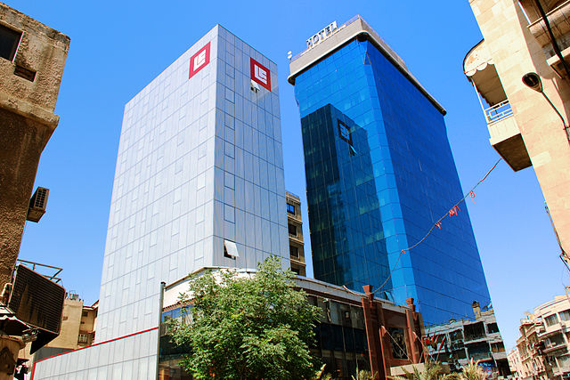 File:BankSharqAndBlueTower.jpg