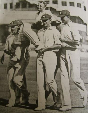 File:Bradman chaired.jpg