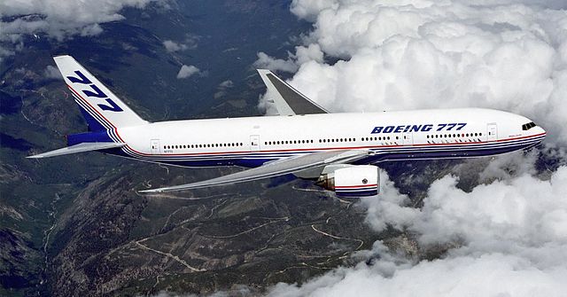 File:Boeing 777 above clouds, crop.jpg