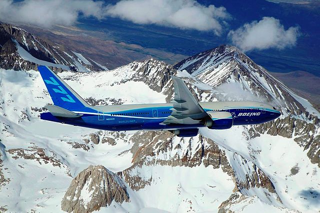 File:Boeing 777-200LR banking over mountain.jpg
