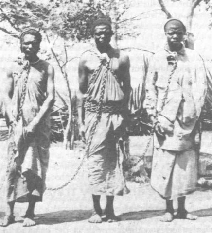 File:Slaves in chains (grayscale).png