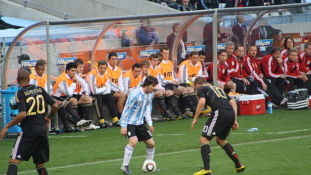 File:Messi Podolski Boateng bench 2010.jpg