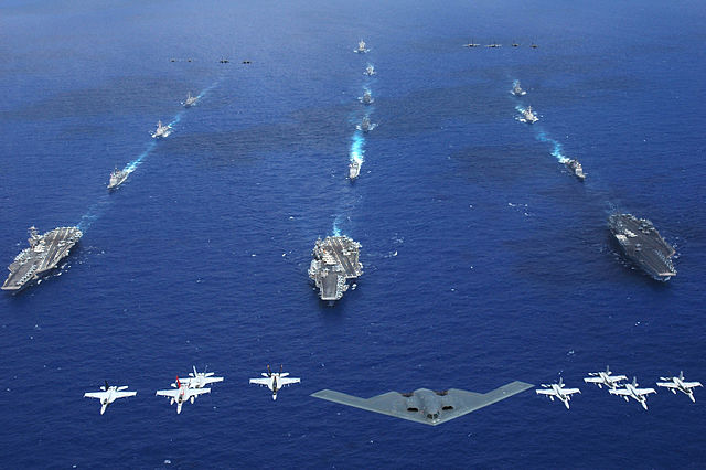 File:US Navy 060618-N-8492C-212 An Air Force B-2 bomber along with other aircrafts from the Air Force, Navy and Marine Corps fly over the Kitty Hawk, Ronald Reagan and Abraham Lincoln Carrier Strike groups.jpg