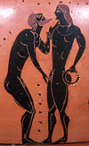 Pederastic courtship scene Athenian black-figure amphora, 5th c. BC, Painter of Cambridge; Object currently in the collection of the Staatliche Antikensammlungen und Glyptothek, Munich, Germany. The bearded man is depicted in a traditional pederastic courtship gesture known as the