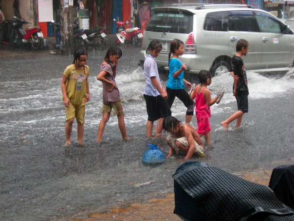 File:Saigon children in rain.jpg